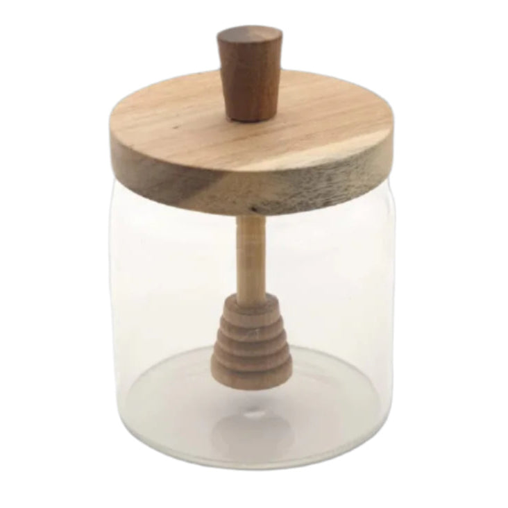 Glass jar with wooden lid and handle on a white background