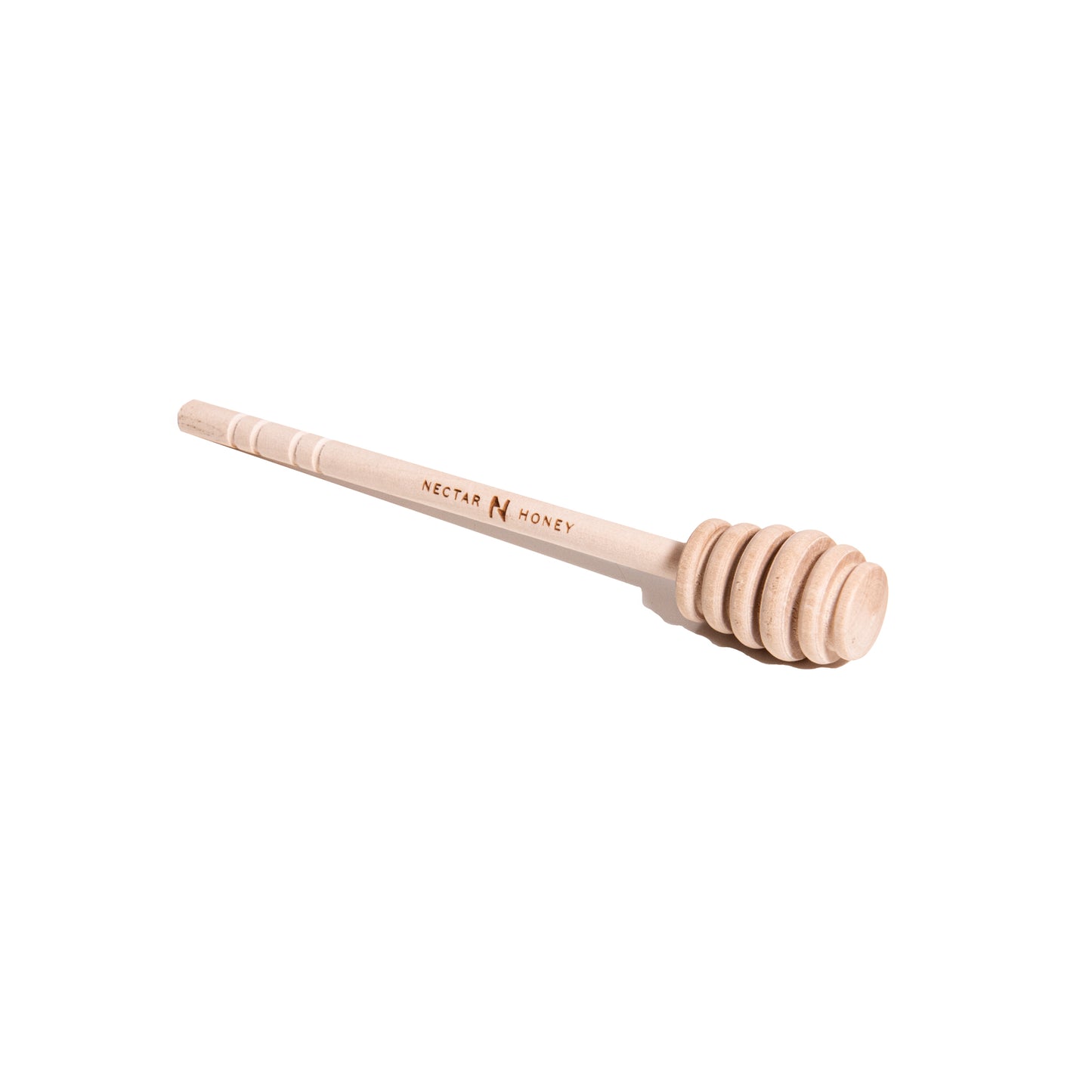 Wooden honey dipper with 'Nectar Honey' branding on a white background