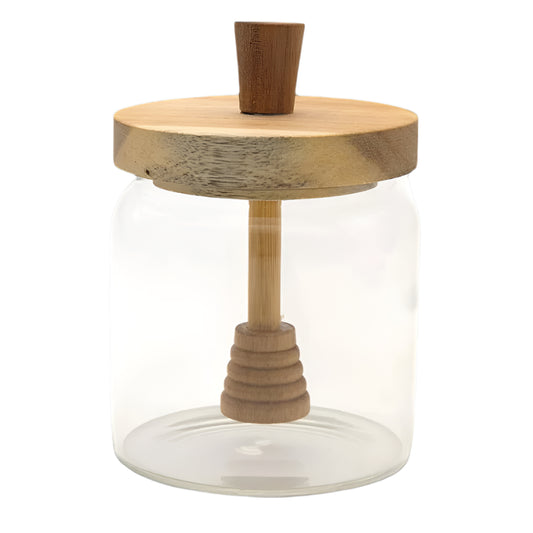 Glass jar with wooden lid and handle on a white background