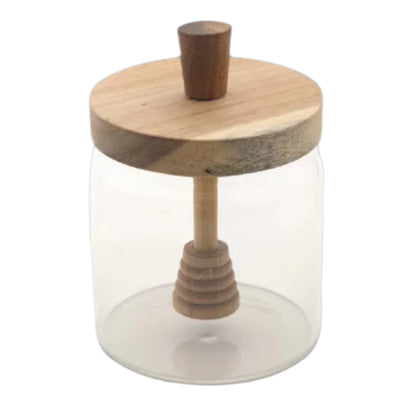 Glass jar with wooden lid and handle on a white background